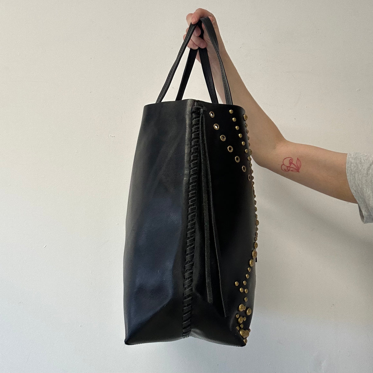 black studded eyelet large faux leather shoulder bag