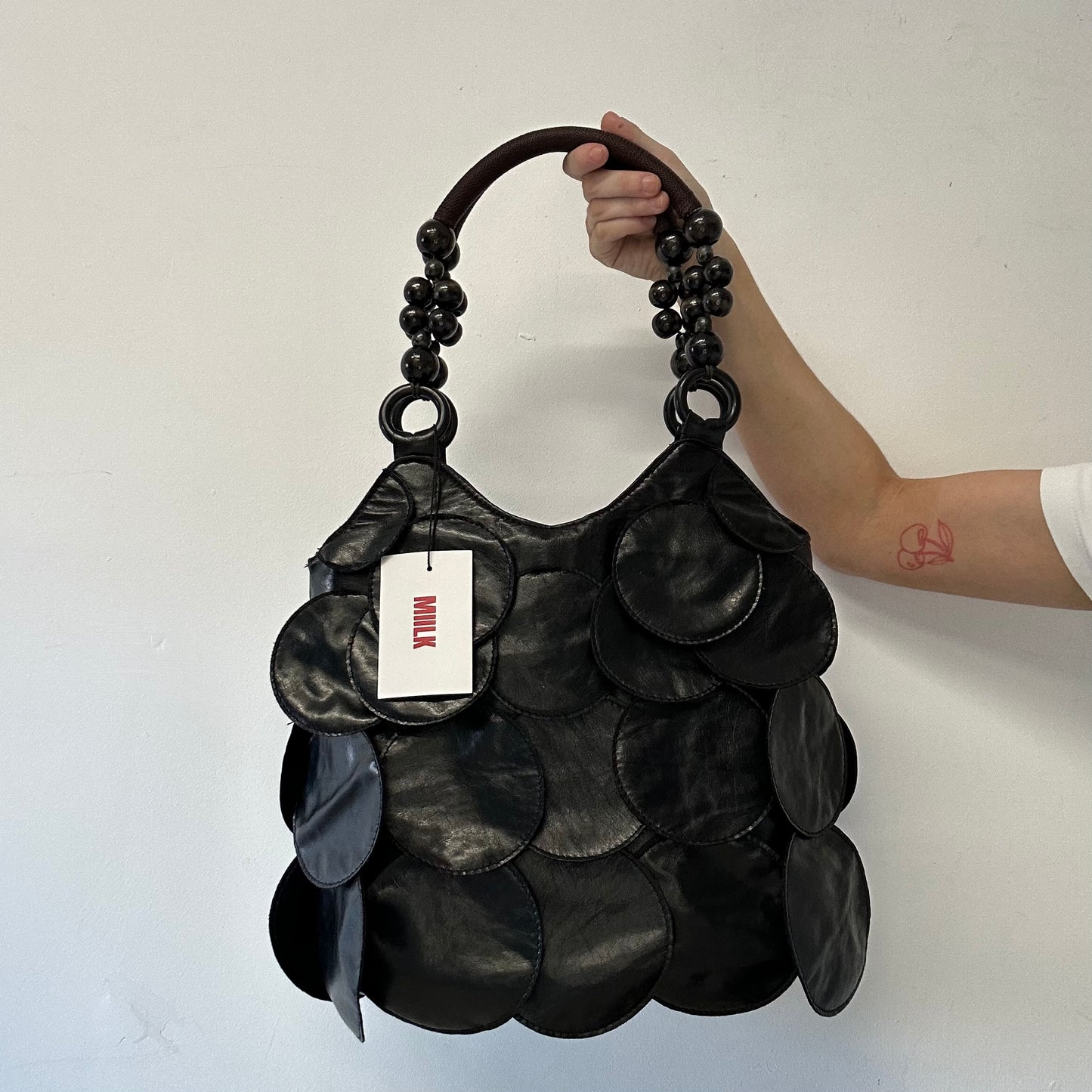 black faux leather disc beaded shoulder bag