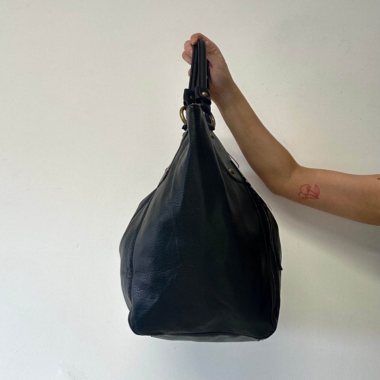 black faux leather single zip shoulder bag