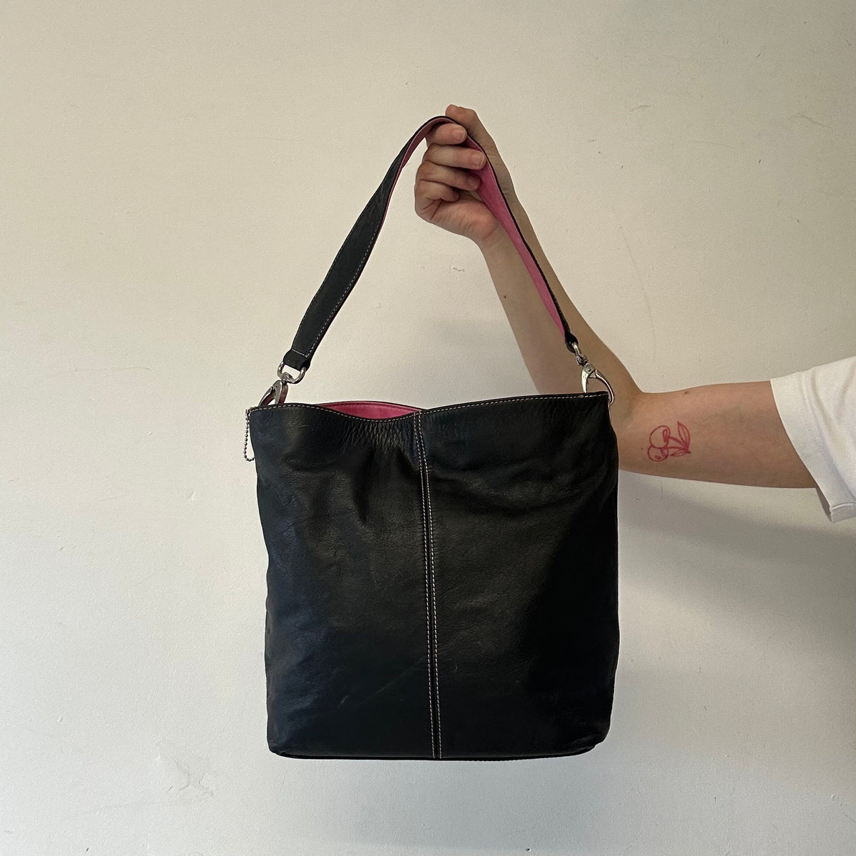 black and pink “J”  faux leather shoulder bag