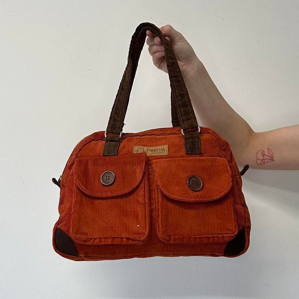 orange and brown corduroy shoulder bag