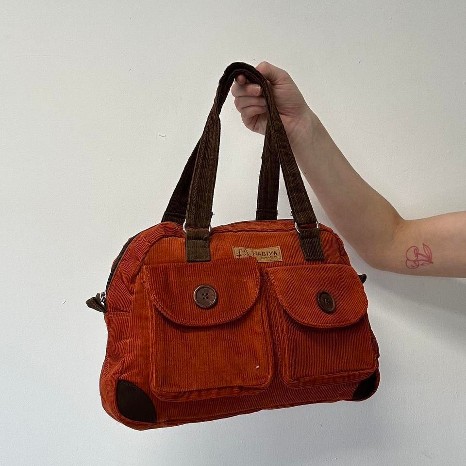 orange and brown corduroy shoulder bag