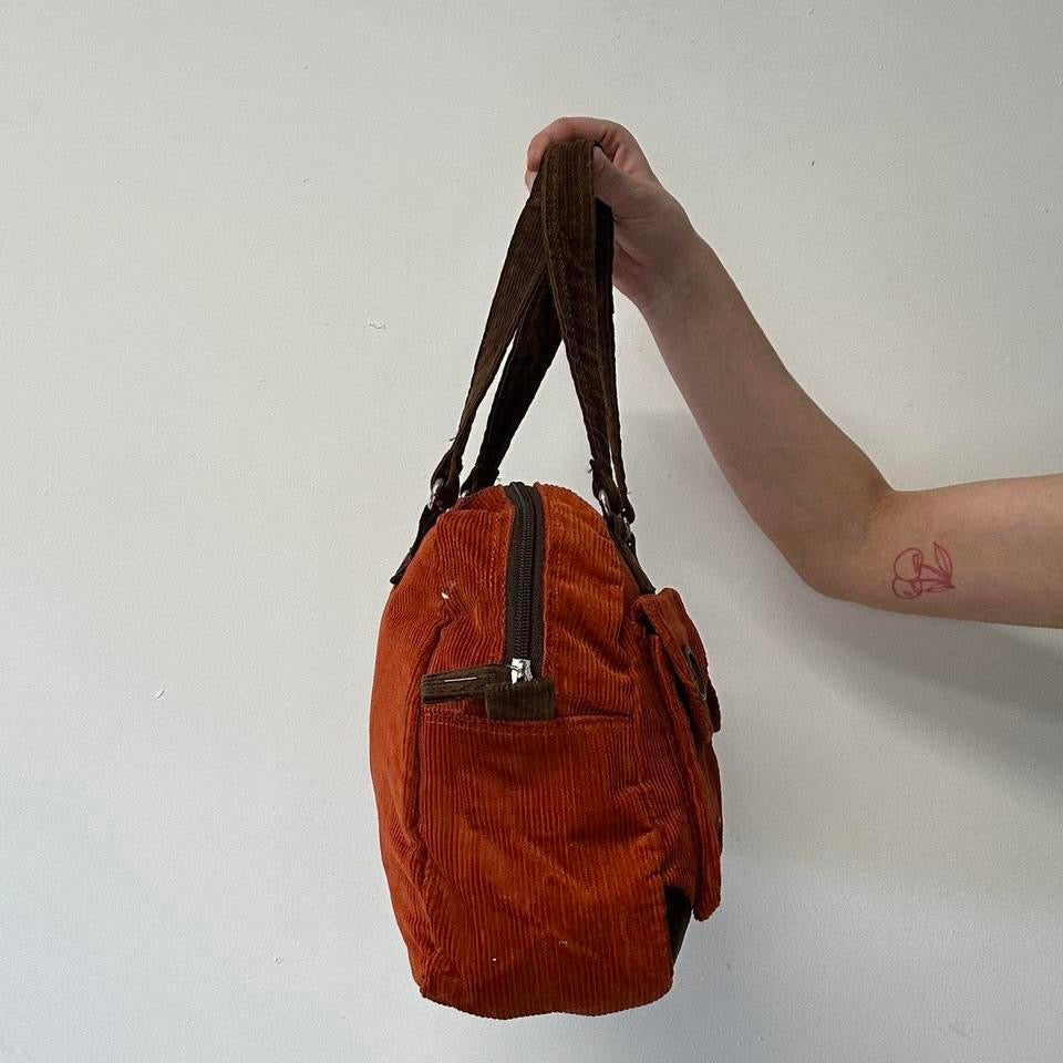 orange and brown corduroy shoulder bag