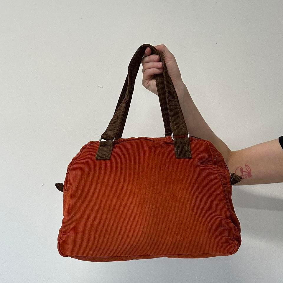 orange and brown corduroy shoulder bag
