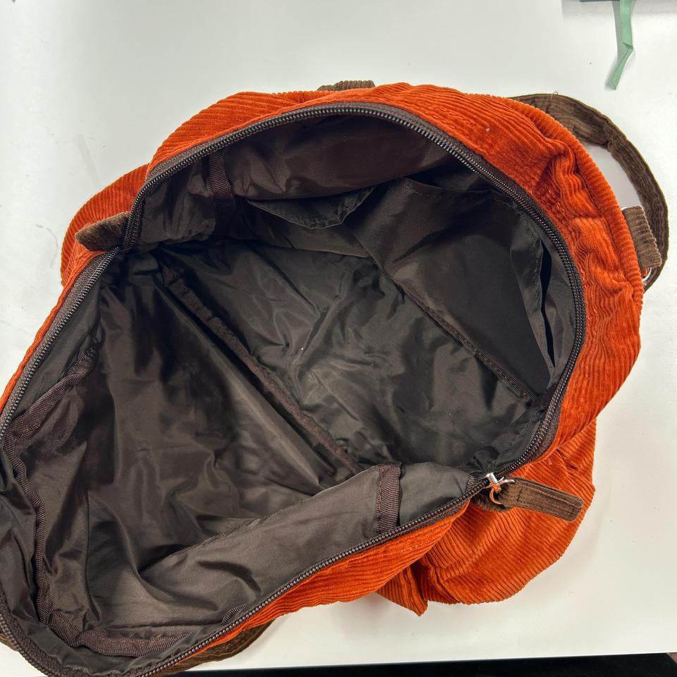 orange and brown corduroy shoulder bag