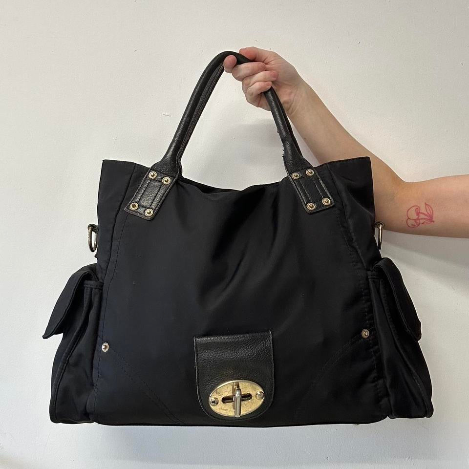 black canvas buckle shoulder bag