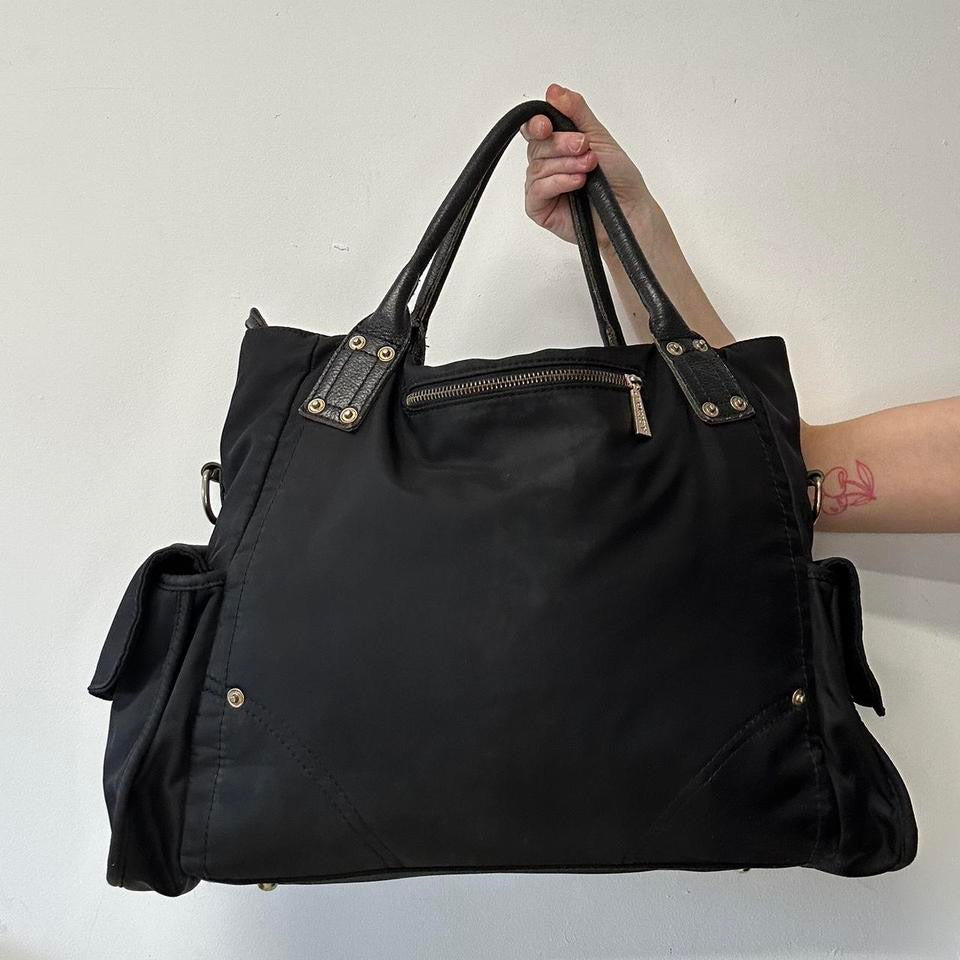 black canvas buckle shoulder bag