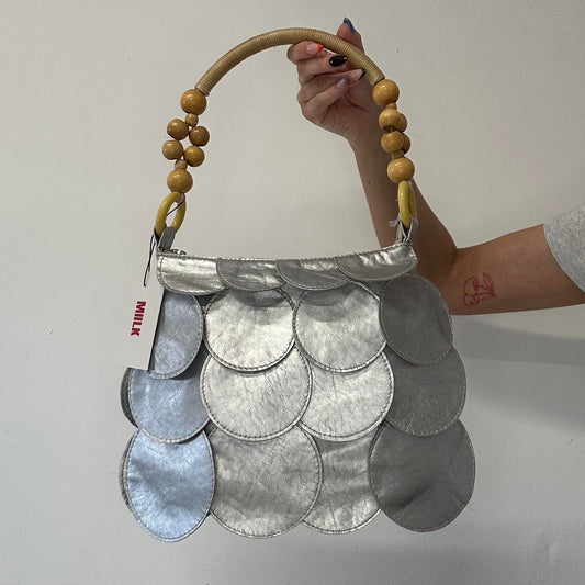 silver faux leather disc bag