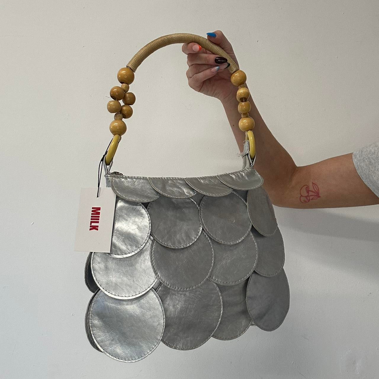 silver faux leather disc bag
