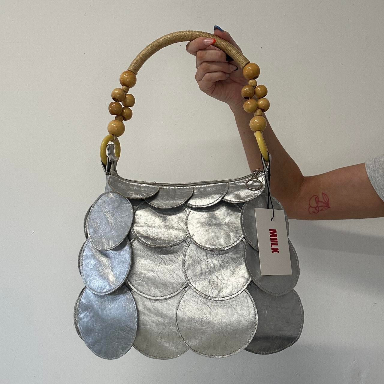 silver faux leather disc bag