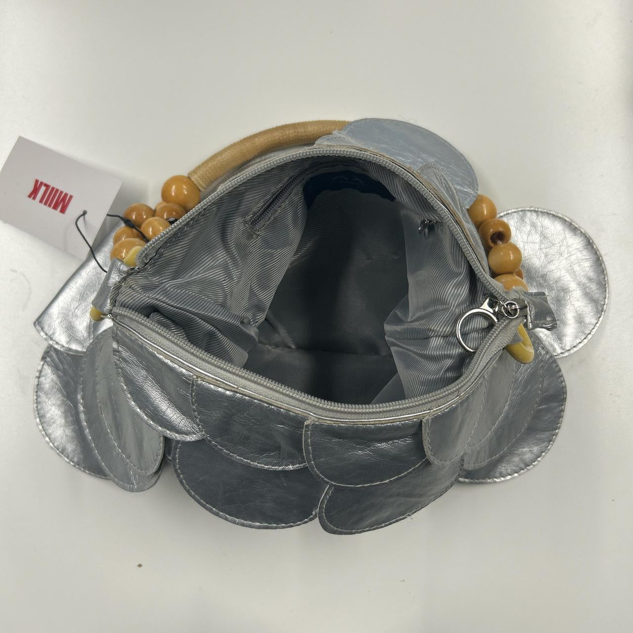 silver faux leather disc bag